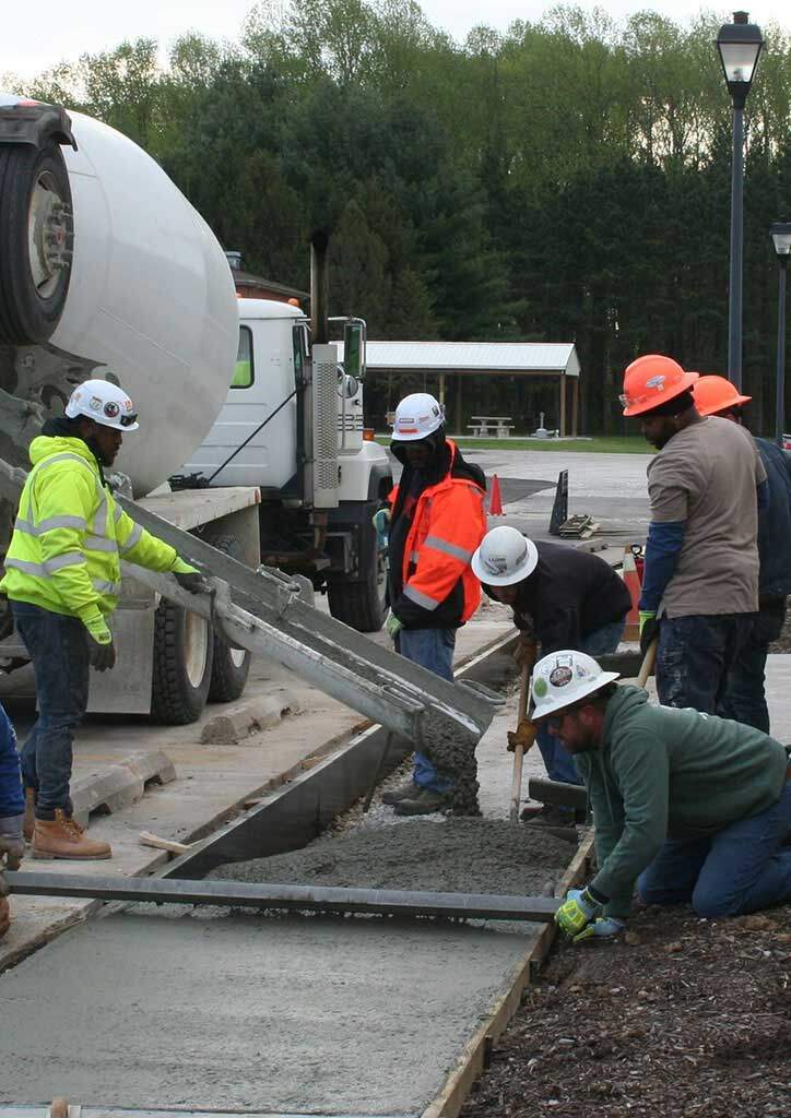 laborers apprentices pouring concrete at training center